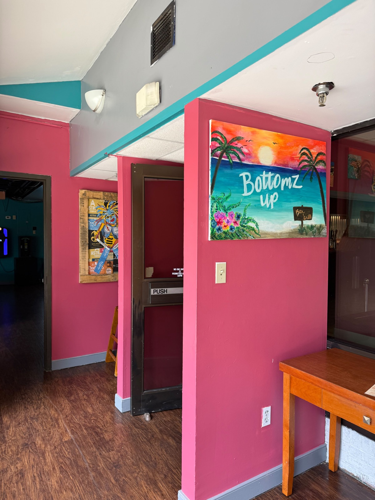 Hand-painted Bottomz Up mural at the entrance